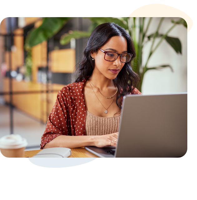 Woman with glasses on a laptop