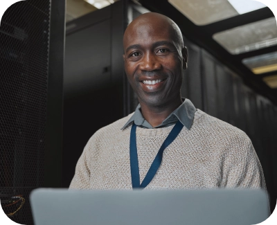 A man looking at a tablet while smiling