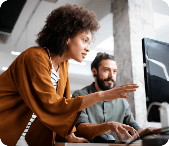 business woman and man checking computer